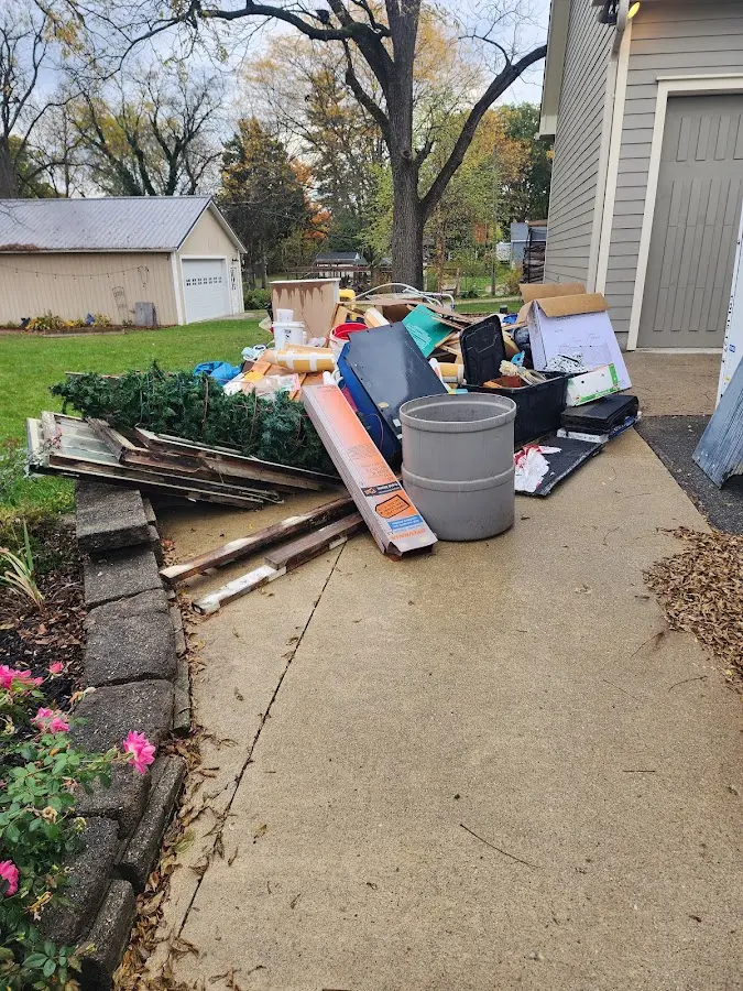 Dumpster being loaded with debris for 10 Yard Dumpster Rental in Riverview